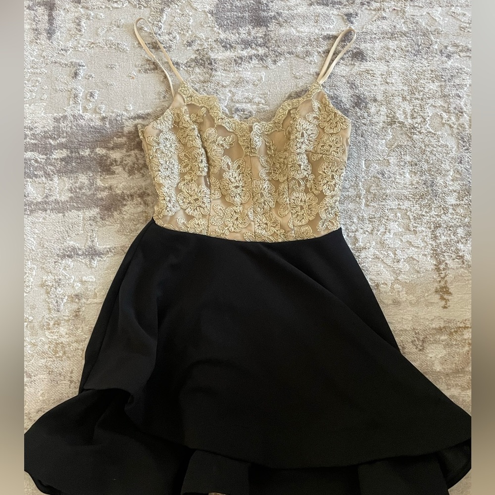 Graduation dress, with gold top and black skirt. Excellent conditions.